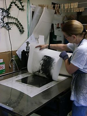 Janet lifts the print off the plate