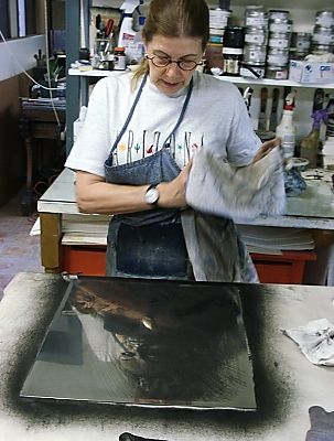 Janet cleans the plate to start a new proof